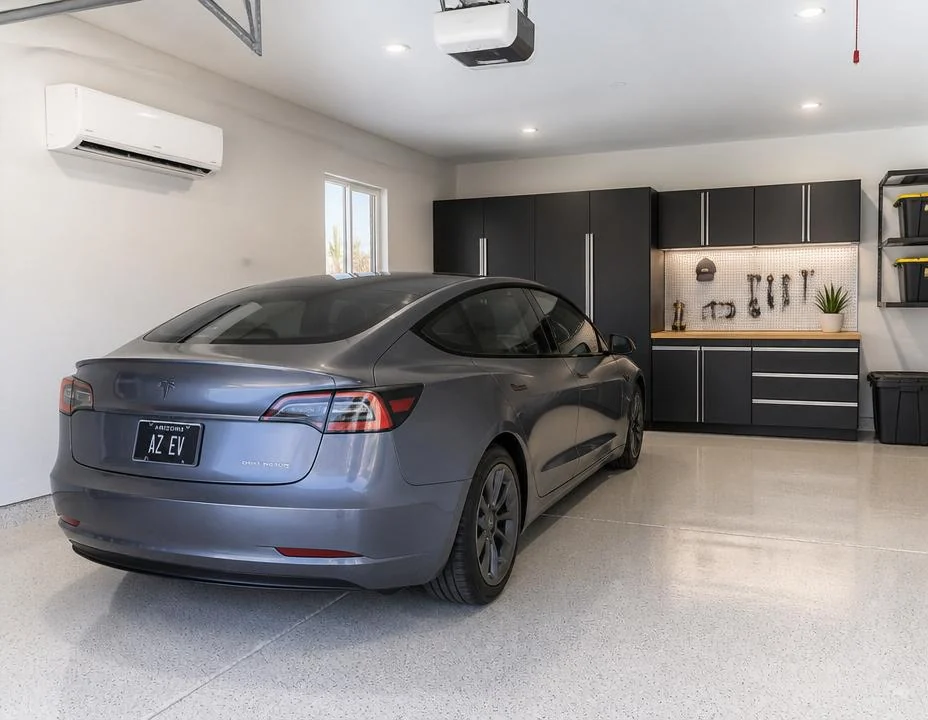 Clean one-car Arizona garage with an EV and a ductless wall unit